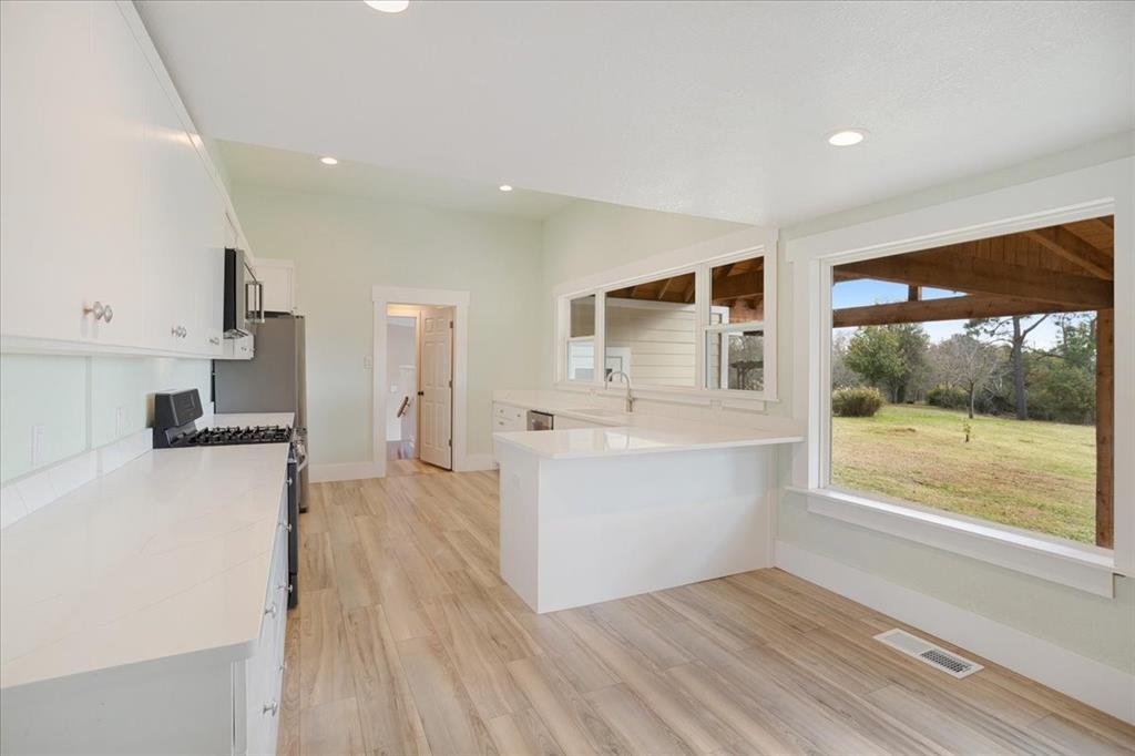 40 Sheryl Lane Denison, TX 75021 - Photo 18 of 40 a view of a kitchen with wooden floor and a kitchen