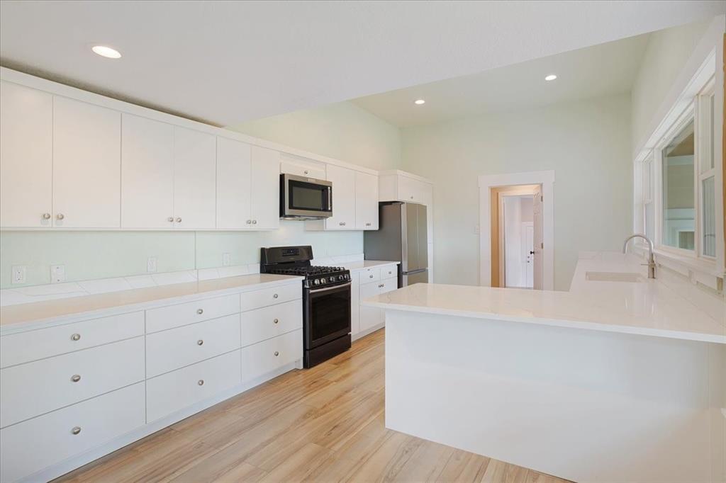 40 Sheryl Lane Denison, TX 75021 - Photo 19 of 40 a large white kitchen with cabinets
