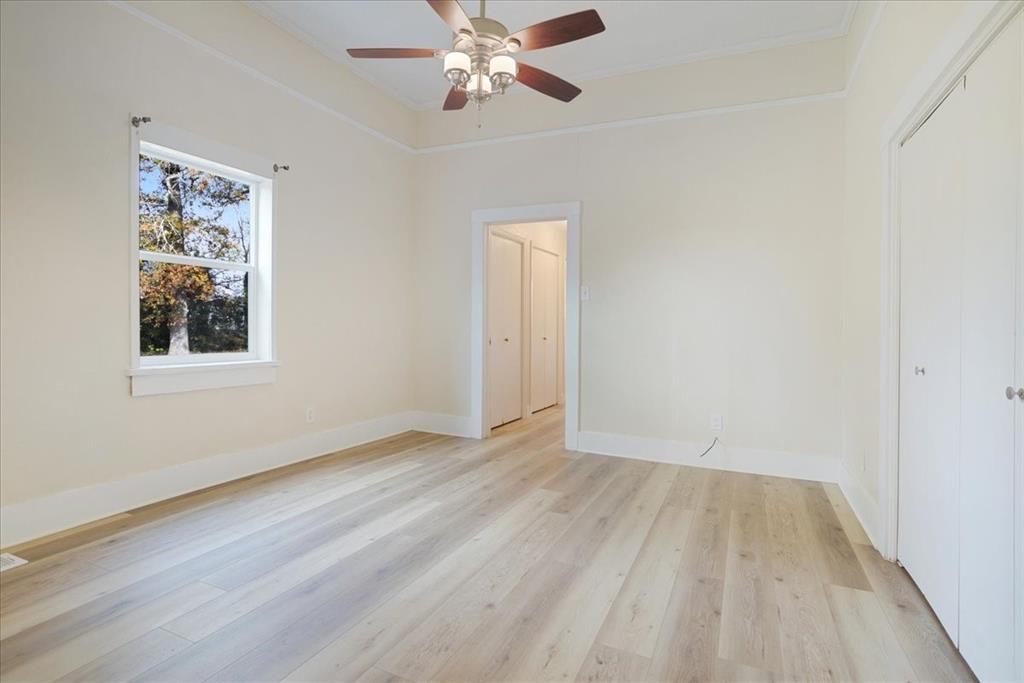 40 Sheryl Lane Denison, TX 75021 - Photo 26 of 40 a view of an empty room with wooden floor and a window