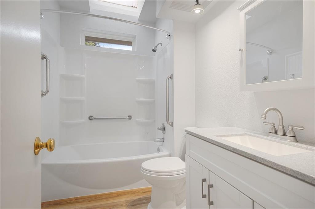 40 Sheryl Lane Denison, TX 75021 - Photo 27 of 40 a bathroom with a sink a toilet and a bathtub