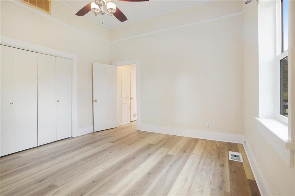 40 Sheryl Lane Denison, TX 75021 - Photo 28 of 40 an empty room with a hardwood and ceiling fan