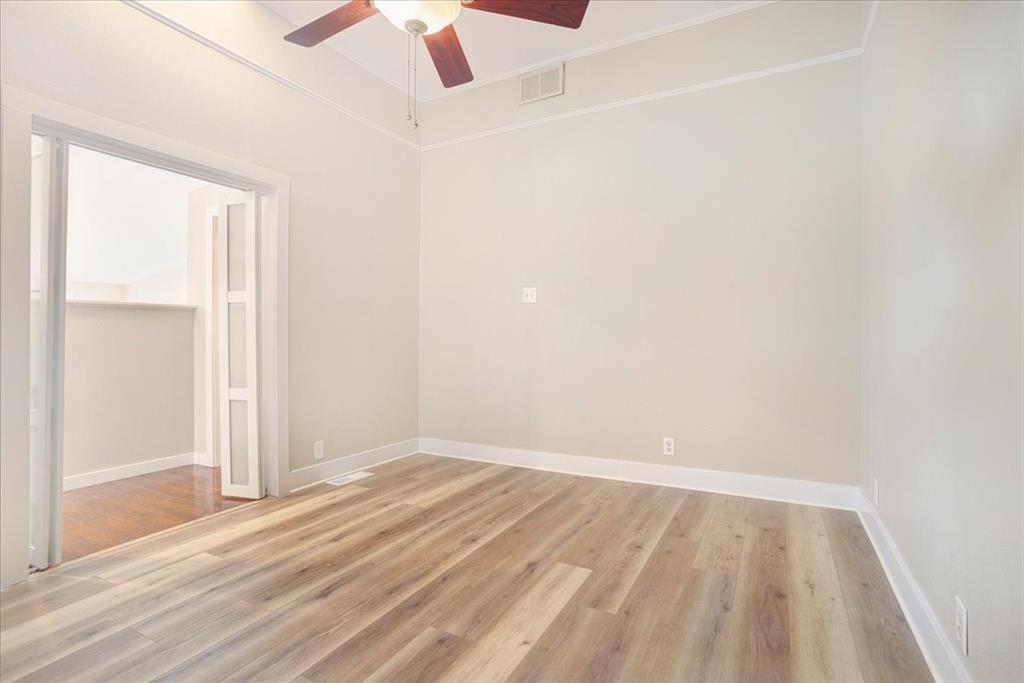 40 Sheryl Lane Denison, TX 75021 - Photo 30 of 40 an empty room with a window and a ceiling fan