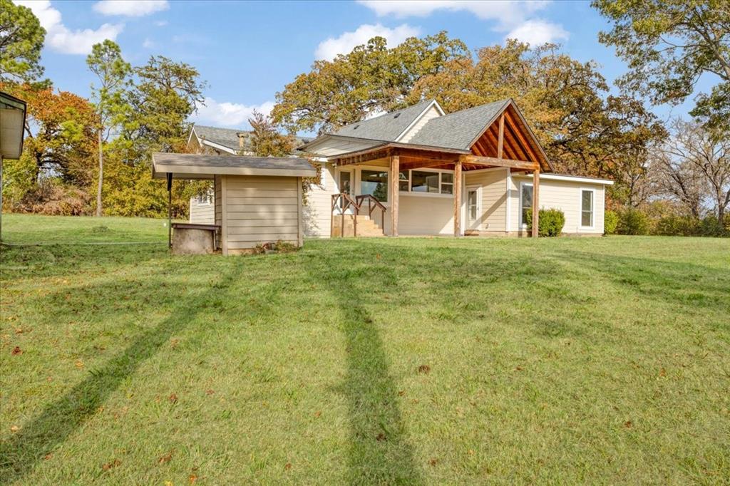 40 Sheryl Lane Denison, TX 75021 - Photo 10 of 40 a front view of a house with a garden