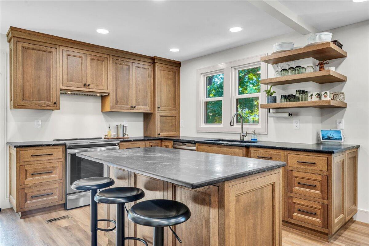 3007 Green Ridge Road Roanoke, VA 24019 - Photo 11 of 56 a kitchen with stainless steel appliances granite countertop a stove a sink and a refrigerator