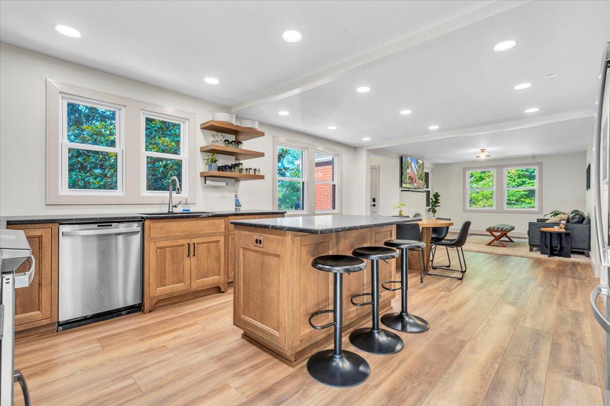 3007 Green Ridge Road Roanoke, VA 24019 - Photo 12 of 56 a kitchen with stainless steel appliances granite countertop a stove and a wooden floors