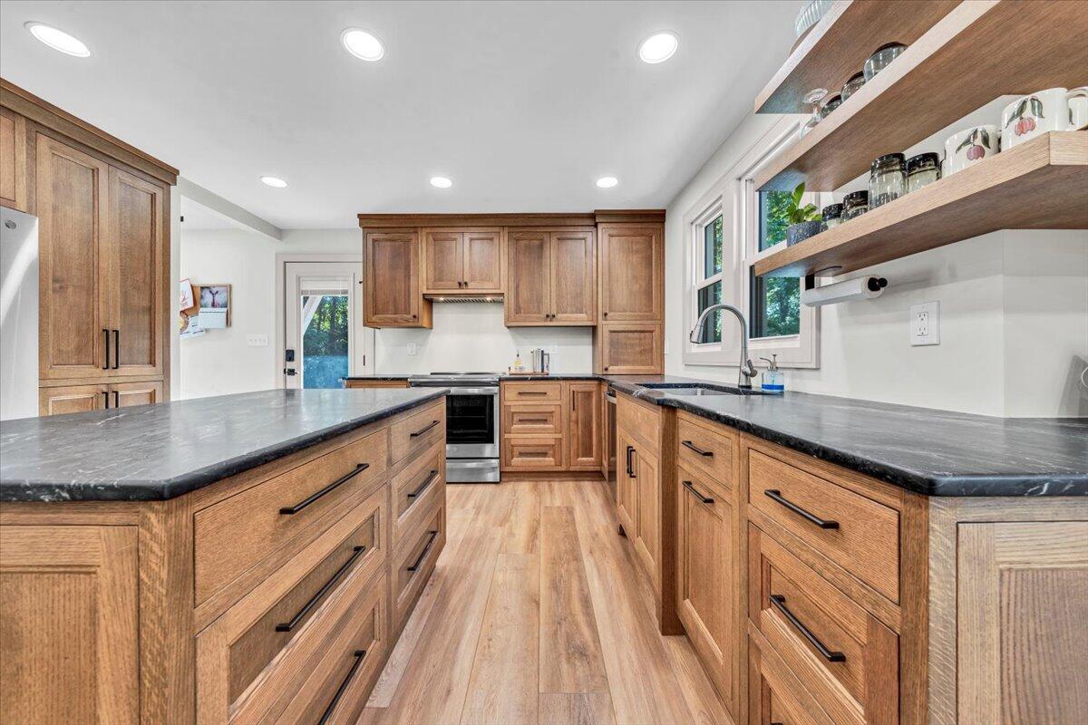 3007 Green Ridge Road Roanoke, VA 24019 - Photo 14 of 56 a kitchen with stainless steel appliances granite countertop a sink and cabinets