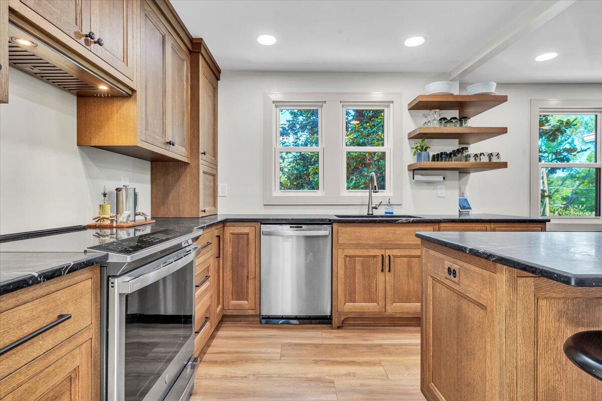 3007 Green Ridge Road Roanoke, VA 24019 - Photo 15 of 56 a kitchen with stainless steel appliances granite countertop a stove a sink and a microwave