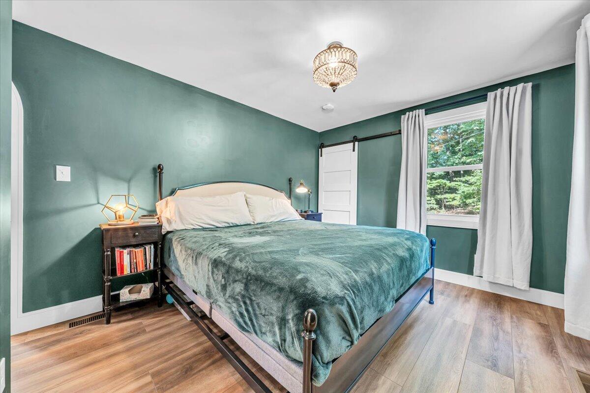 3007 Green Ridge Road Roanoke, VA 24019 - Photo 16 of 56 a bed sitting in a bedroom next to a window