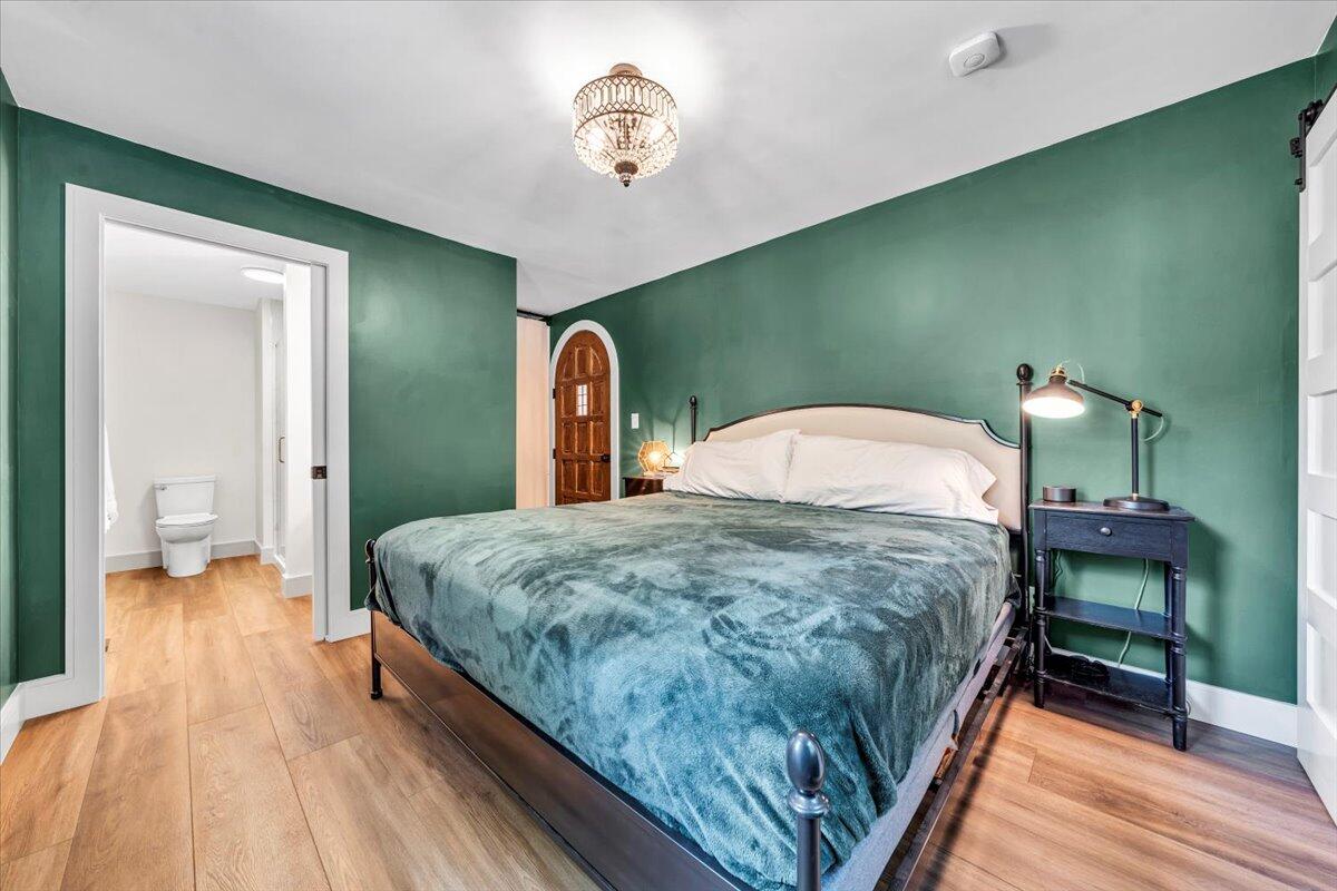3007 Green Ridge Road Roanoke, VA 24019 - Photo 17 of 56 a spacious bedroom with a bed and a table
