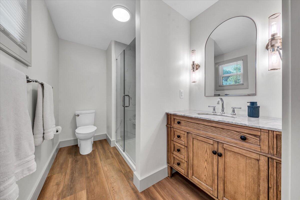 3007 Green Ridge Road Roanoke, VA 24019 - Photo 18 of 56 a spacious bathroom with a double vanity sink a toilet and a mirror