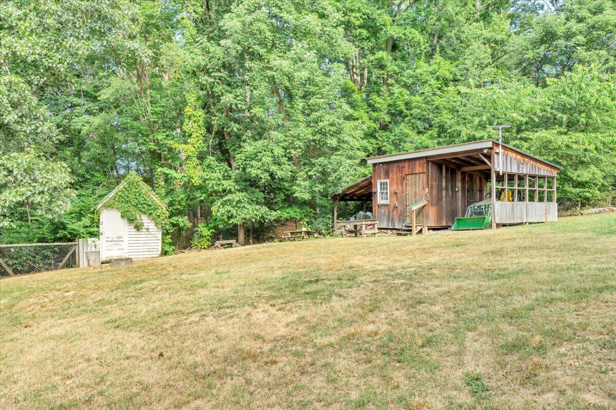 3007 Green Ridge Road Roanoke, VA 24019 - Photo 39 of 56 a yellow house with trees in front of it