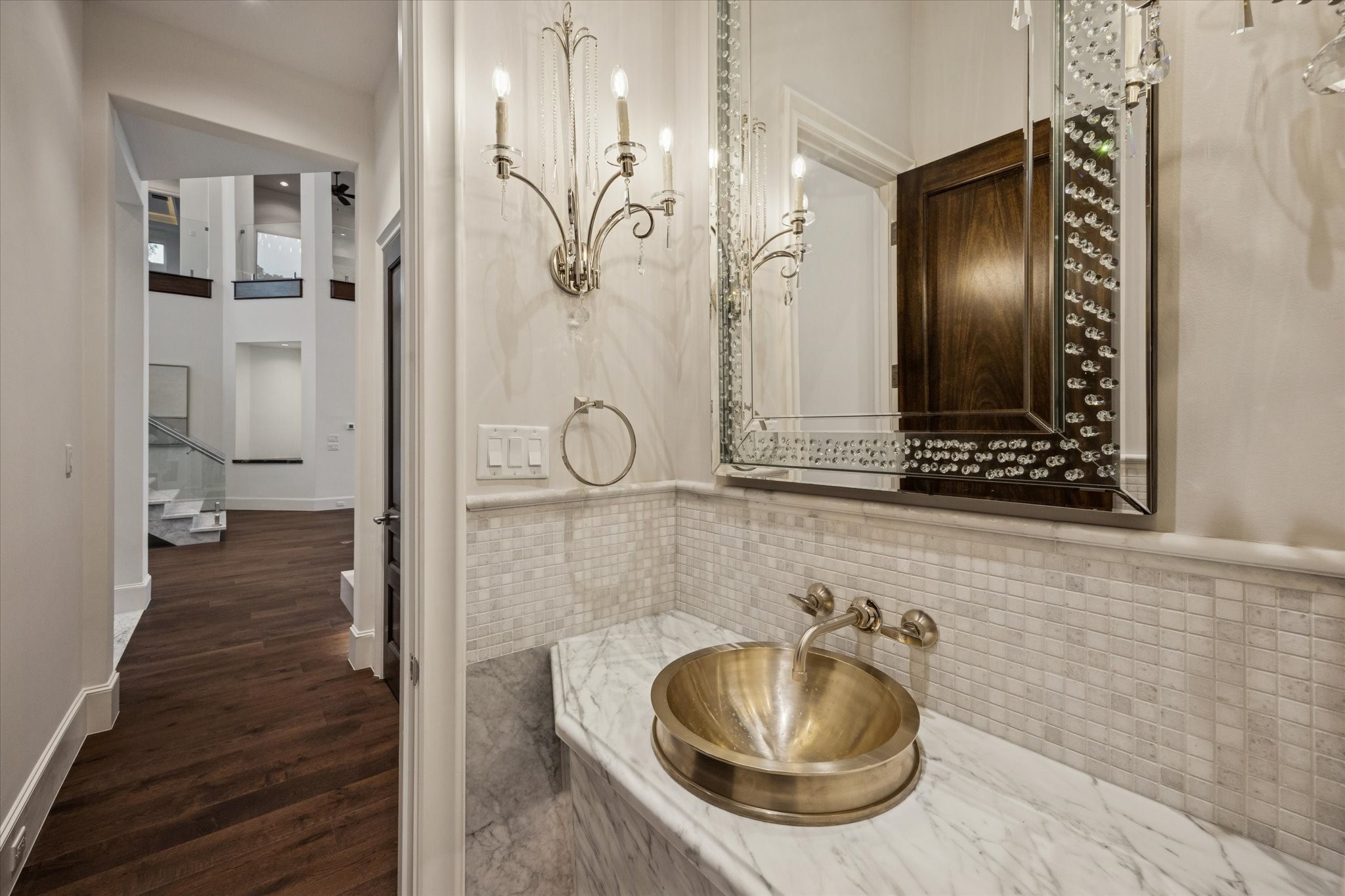 318 Knipp Road Houston, TX 77024 - Photo 9 of 32 This photo features one of two half bathrooms in the home, finished with high-quality fixtures and a stylish design.