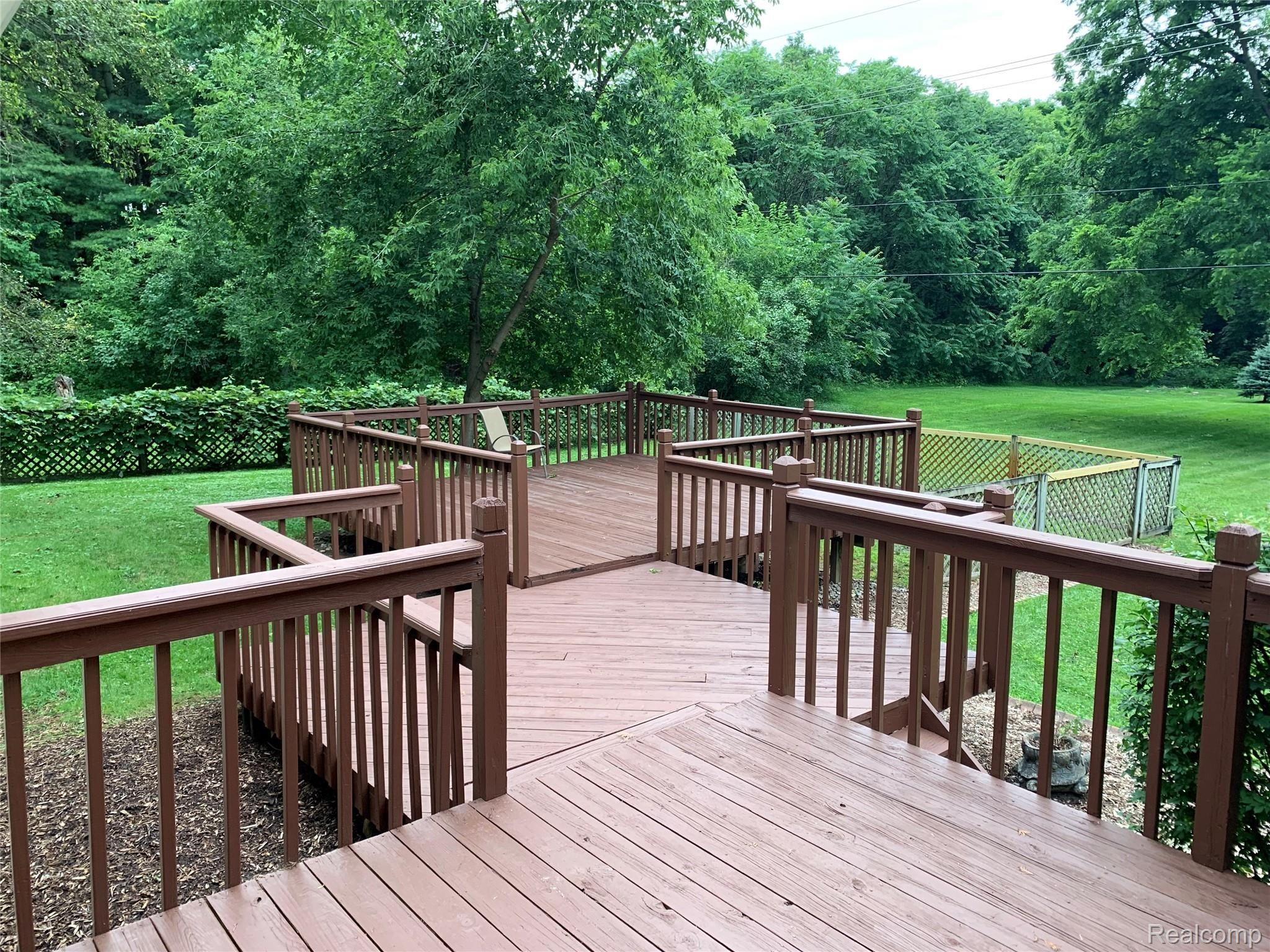 4859 Crooked Lake Road Howell, MI 48843 - Photo 55 of 90 Large 3 tier Deck has room for all your guest and then some!