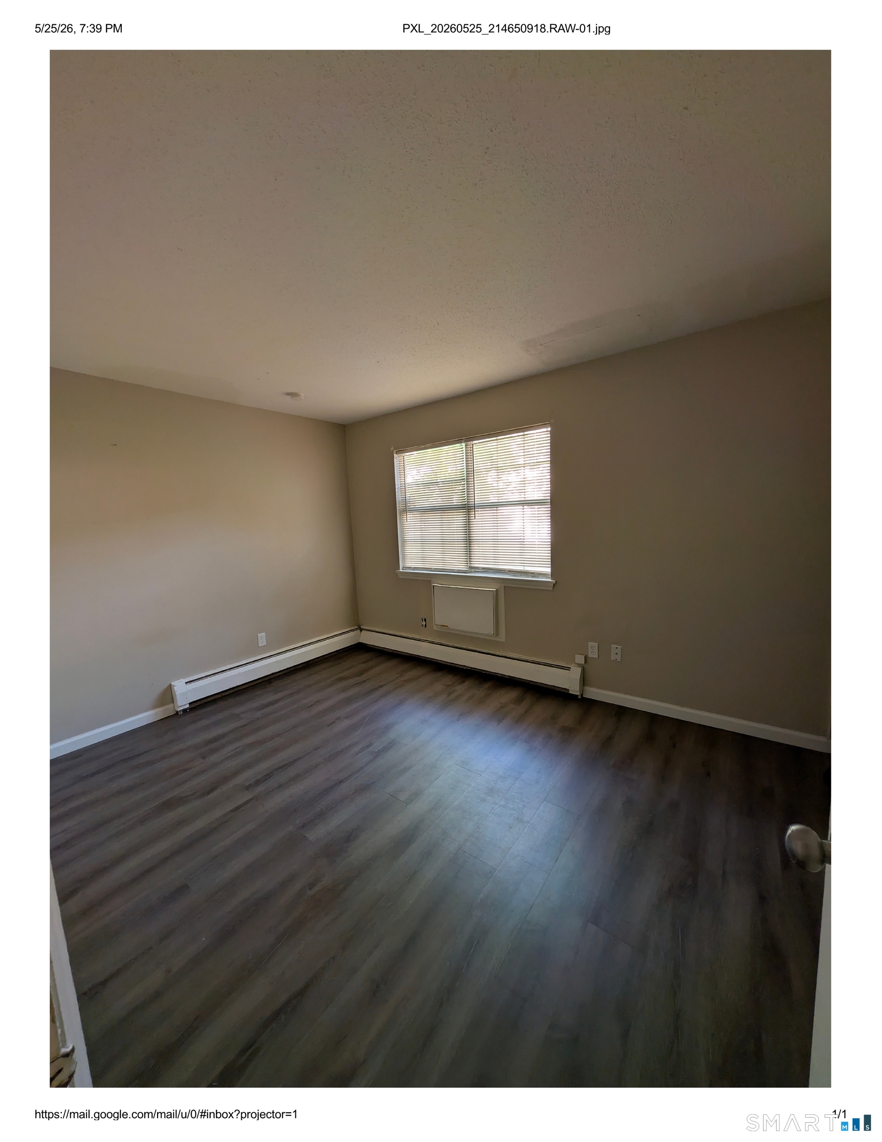 62 Angel Drive, Unit A Waterbury, CT 06708 - Photo 11 of 11 a view of an empty room with wooden floor and a window