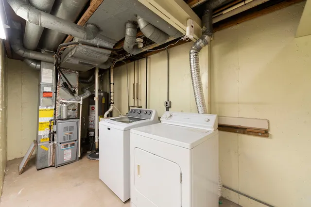 a view of storage and utility room with washer and dryer