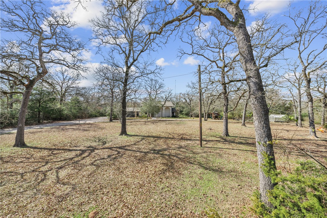 12994 Hunters Creek Road College Station, TX 77845 - Photo 1 of 35 a view of a yard covered with snow