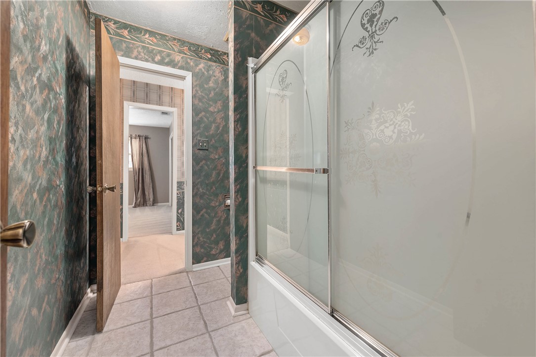 12994 Hunters Creek Road College Station, TX 77845 - Photo 23 of 35 a bathroom with a bathtub and shower