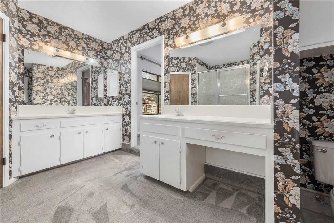 12994 Hunters Creek Road College Station, TX 77845 - Photo 28 of 35 a bathroom with a sink and a mirror