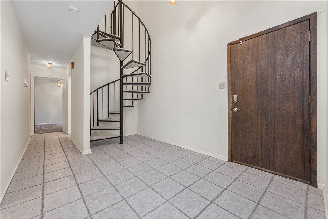 12994 Hunters Creek Road College Station, TX 77845 - Photo 9 of 35 a view of entryway with stairs and wooden floor