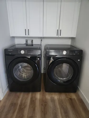 a utility room with washing machine