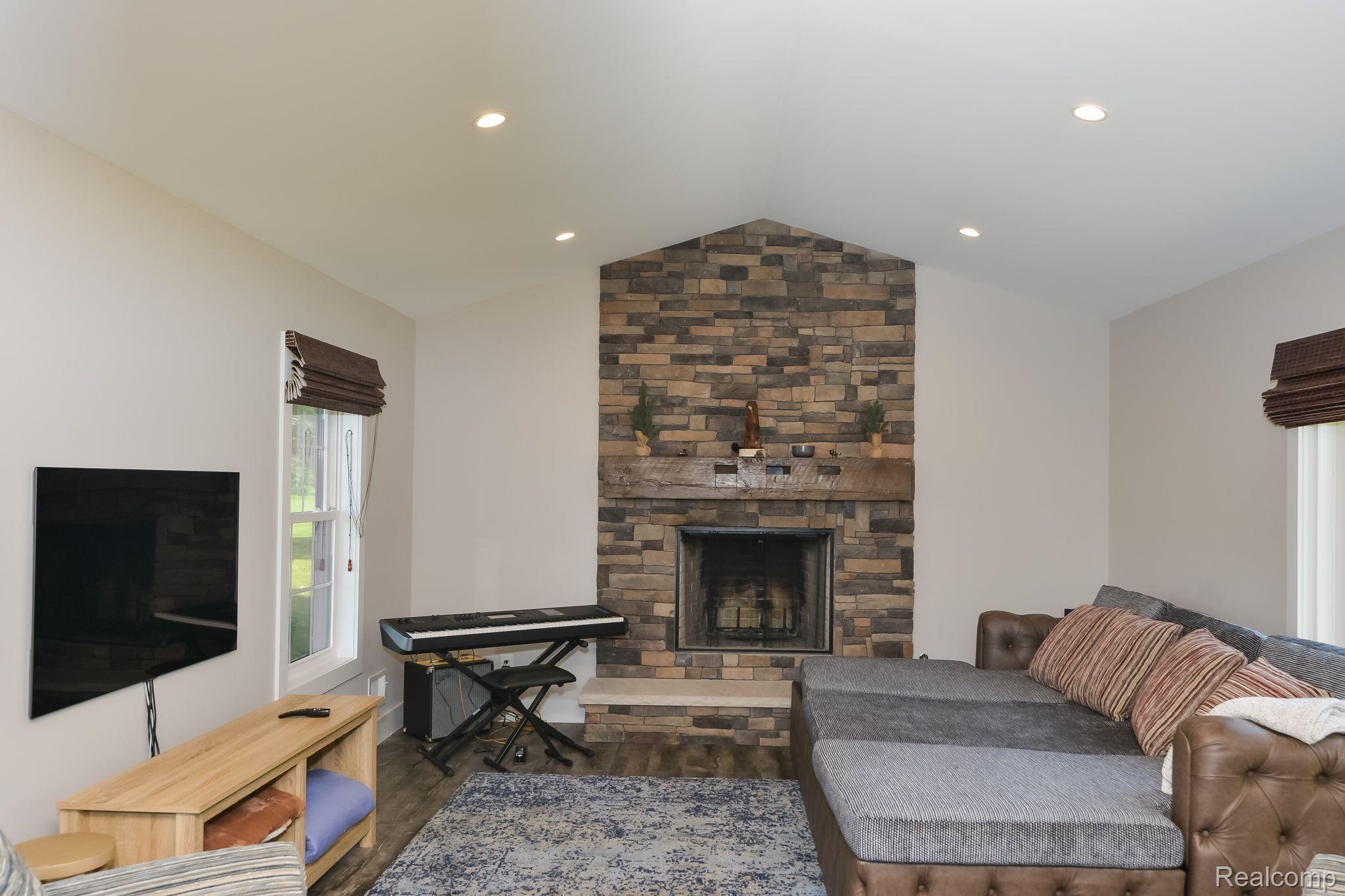 15204 Bishop Road Byron, MI 48418 - Photo 11 of 38 Stone fireplace with optional gas switch or wood b