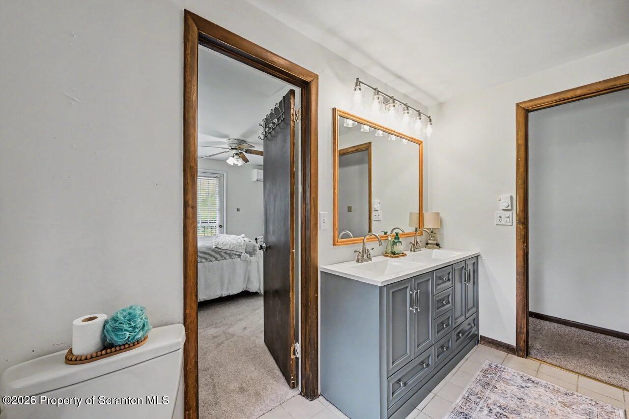 719 Scott Road Clarks Summit, PA 18411 - Photo 35 of 51 a bathroom with a sink and a mirror