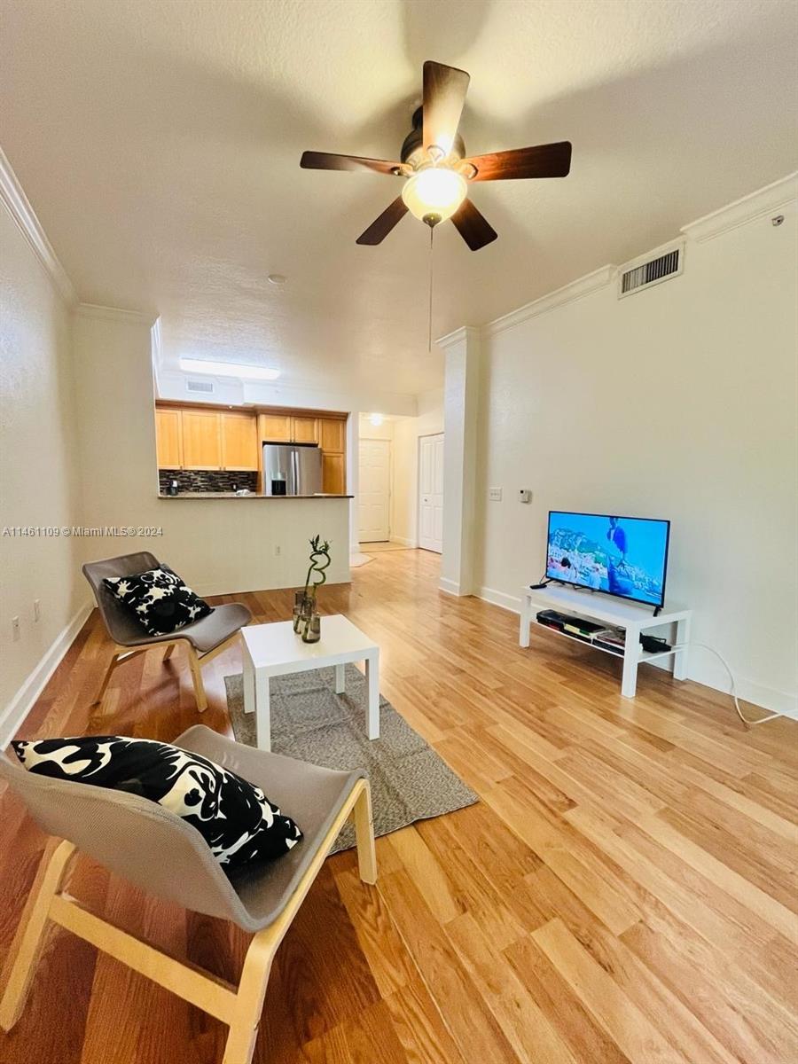1121 Renaissance Way, Unit 1121 Boynton Beach, FL 33426 - Photo 13 of 29 a living room with furniture and a rug