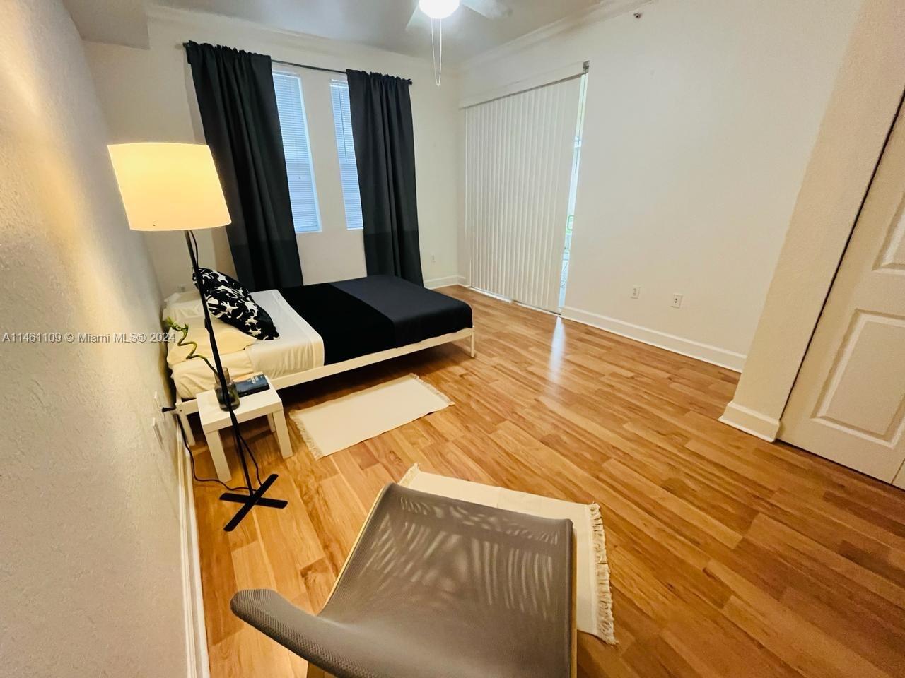 1121 Renaissance Way, Unit 1121 Boynton Beach, FL 33426 - Photo 20 of 29 a view of a hallway with wooden floor