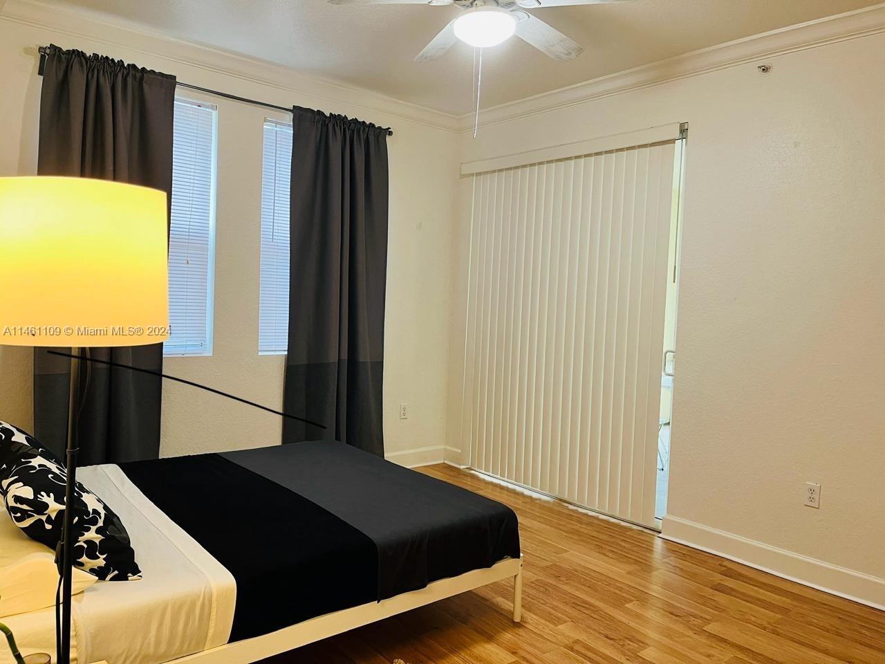 1121 Renaissance Way, Unit 1121 Boynton Beach, FL 33426 - Photo 29 of 29 a bedroom with a bed and a window