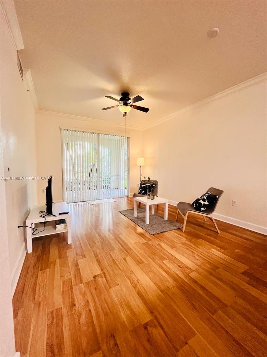1121 Renaissance Way, Unit 1121 Boynton Beach, FL 33426 - Photo 9 of 29 a very nice looking room with a large window and a wooden floor