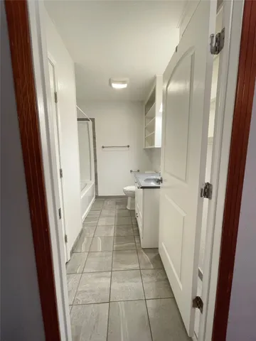 a view of a kitchen from the hallway