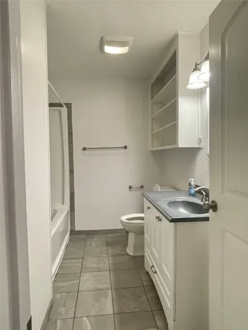 a bathroom with a sink and a toilet