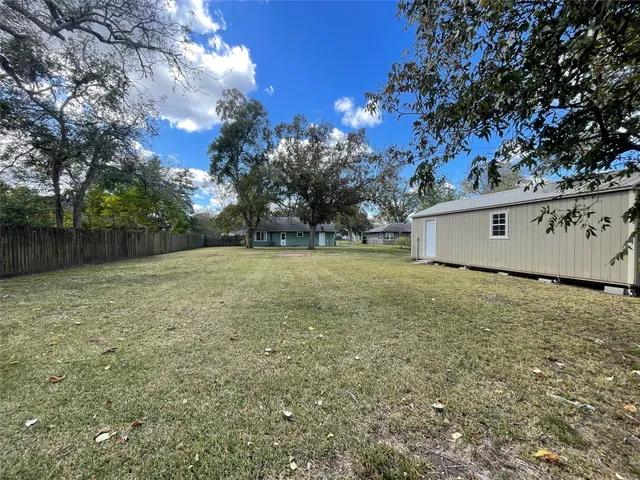 a view of a yard with a tree