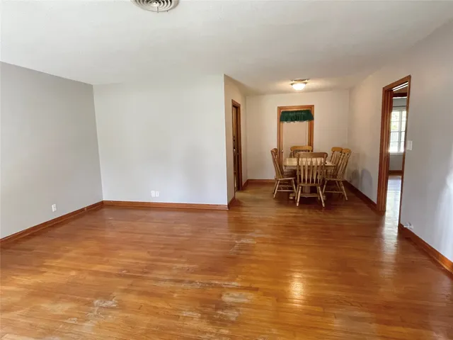 a view of dining room with furniture and wooden floor