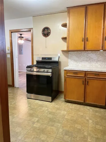 a kitchen with a stove and a cabinet