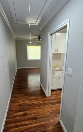 a view of room with window and wooden floor