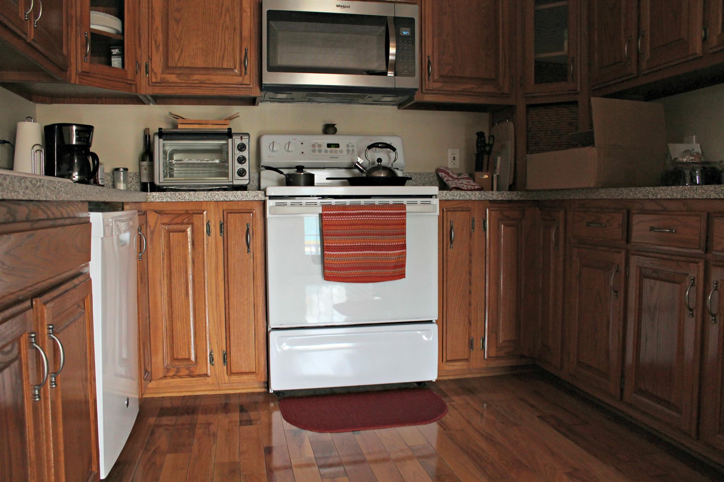 5037 Asbury Road Manchester, TN 37355 - Photo 7 of 13 a kitchen with stainless steel appliances granite countertop a refrigerator and a stove top oven