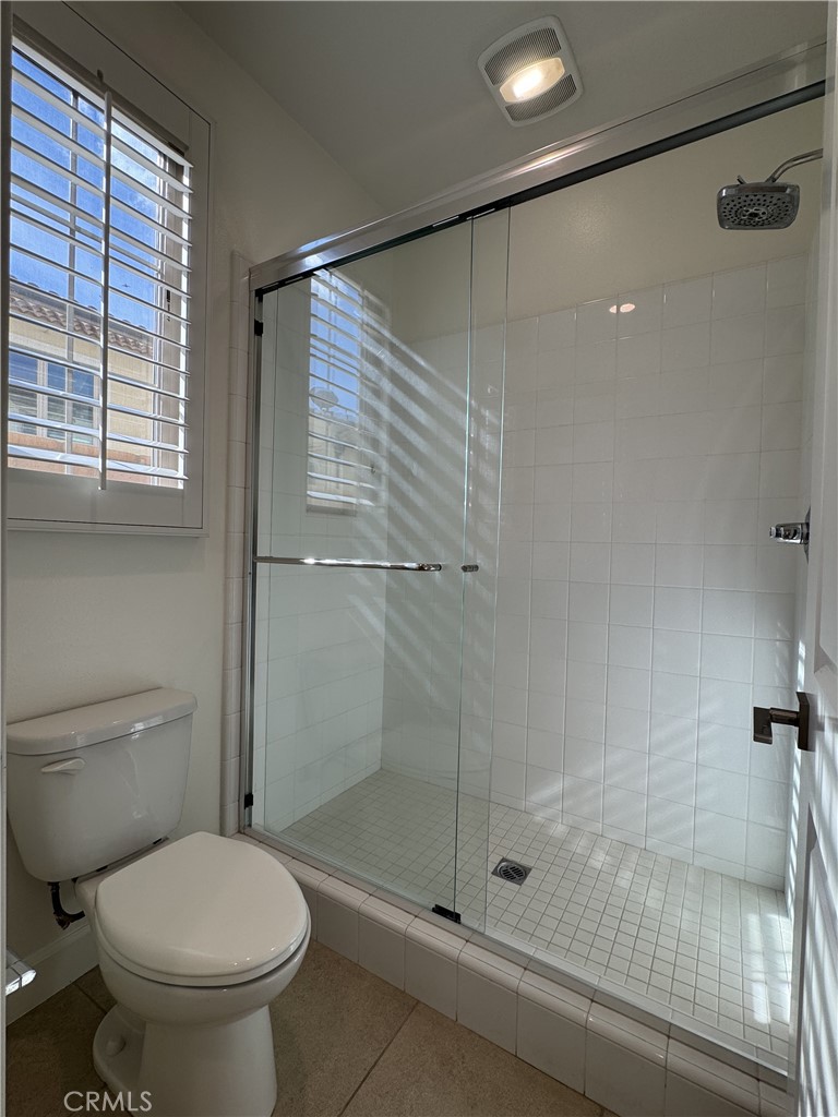66 Diamond Flats Irvine, CA 92602 - Photo 15 of 35 a bathroom with a shower and a toilet