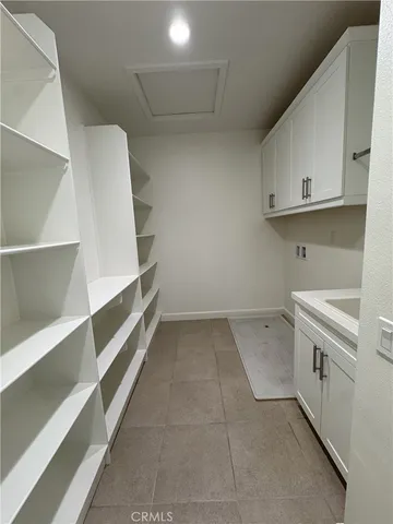 a view of storage and utility room with empty racks