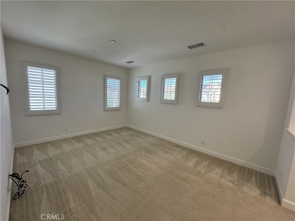 66 Diamond Flats Irvine, CA 92602 - Photo 30 of 35 an empty room with windows