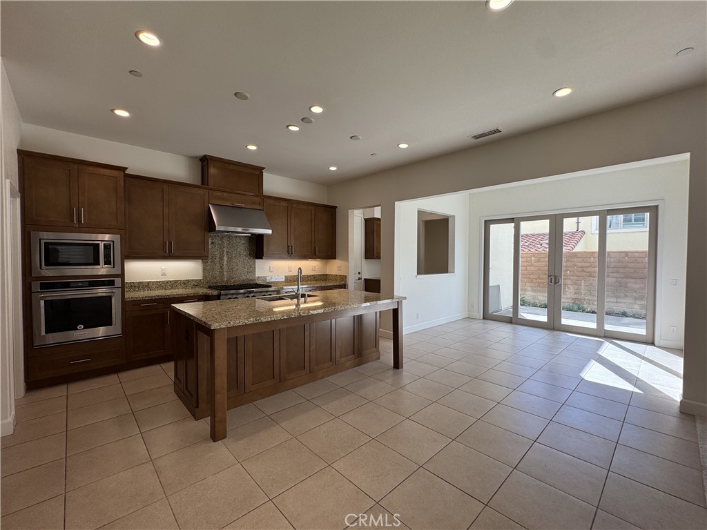 66 Diamond Flats Irvine, CA 92602 - Photo 6 of 35 a large kitchen with stainless steel appliances lots of counter top space