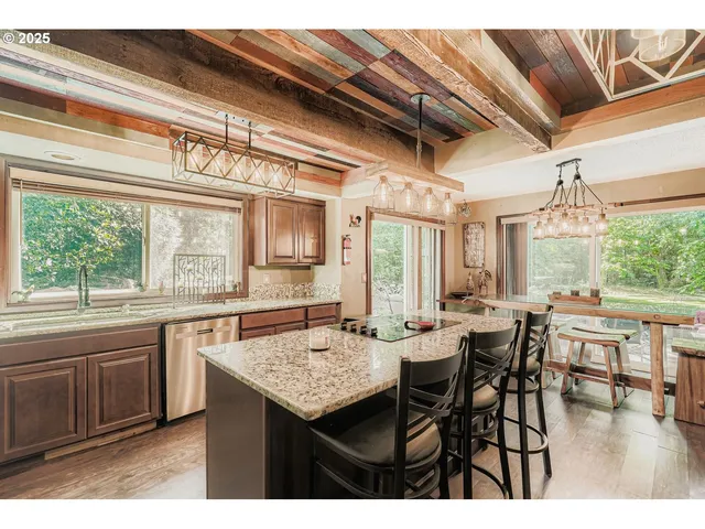 a view of a dining table and chairs in a kitchen