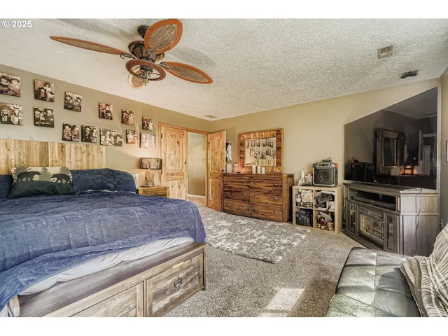 a living room with furniture and flat screen tv