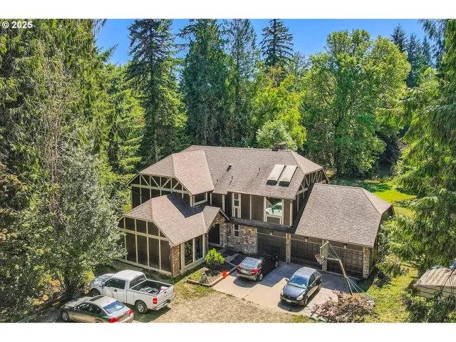 a aerial view of a house with table and chairs