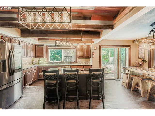 a dining table with chairs and window