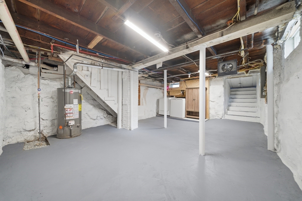 7 Pine Street Stoneham, MA 02180 - Photo 17 of 23 a view of an empty room with stairs