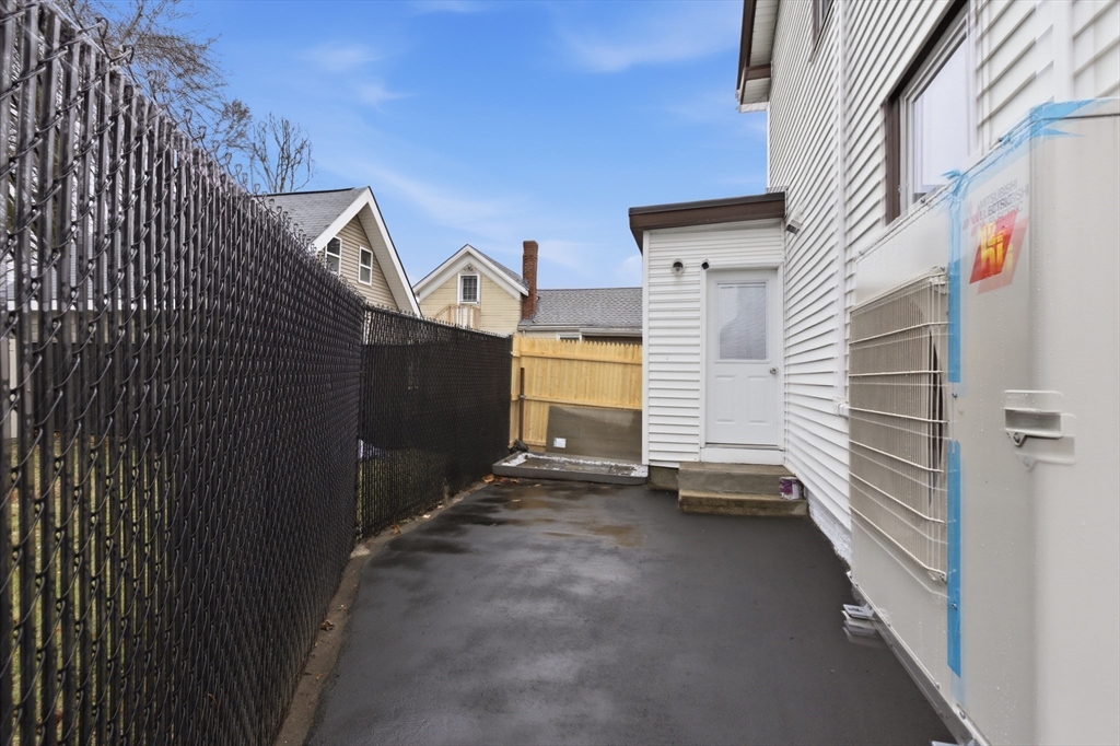 7 Pine Street Stoneham, MA 02180 - Photo 18 of 23 a view of a house with a door