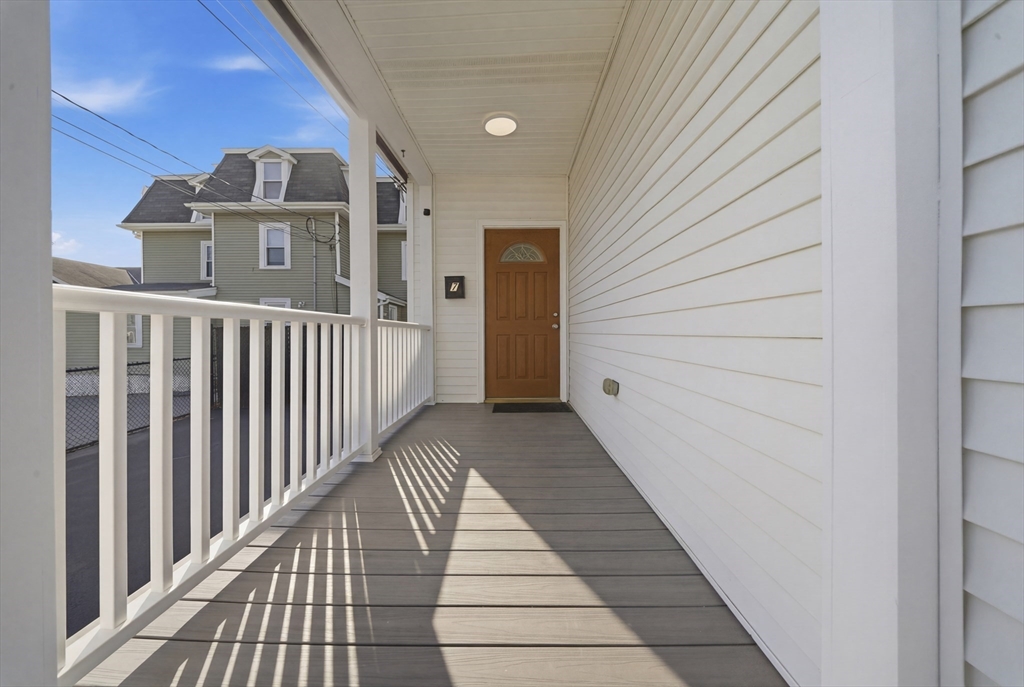 7 Pine Street Stoneham, MA 02180 - Photo 3 of 23 a view of a porch with wooden floor