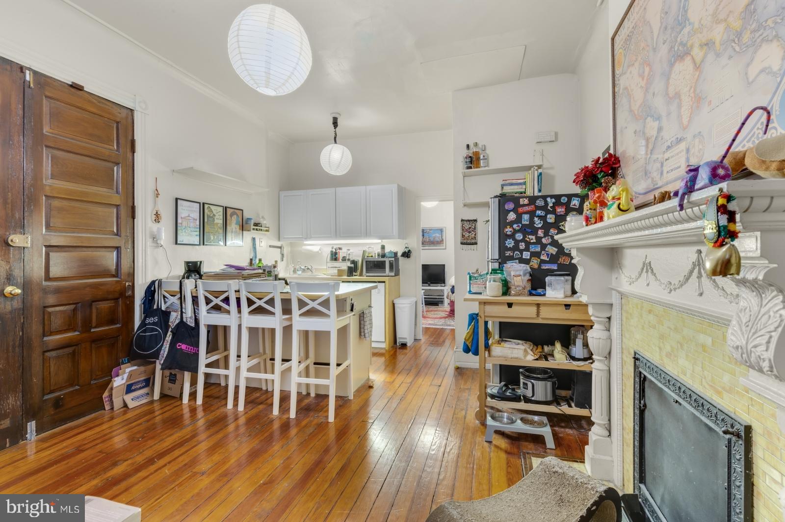a dining room with furniture wooden floor and a rug