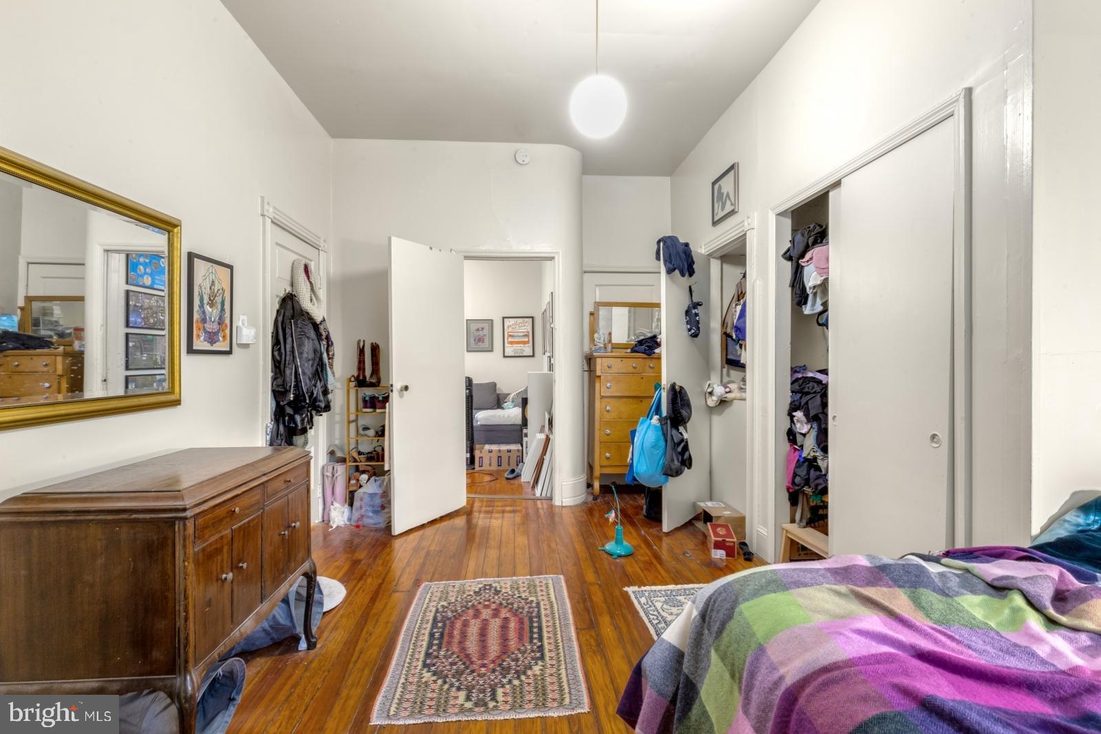 4713 Baltimore Avenue, Unit 1 Philadelphia, PA 19143 - Photo 14 of 22 a bedroom with a bed furniture and a window